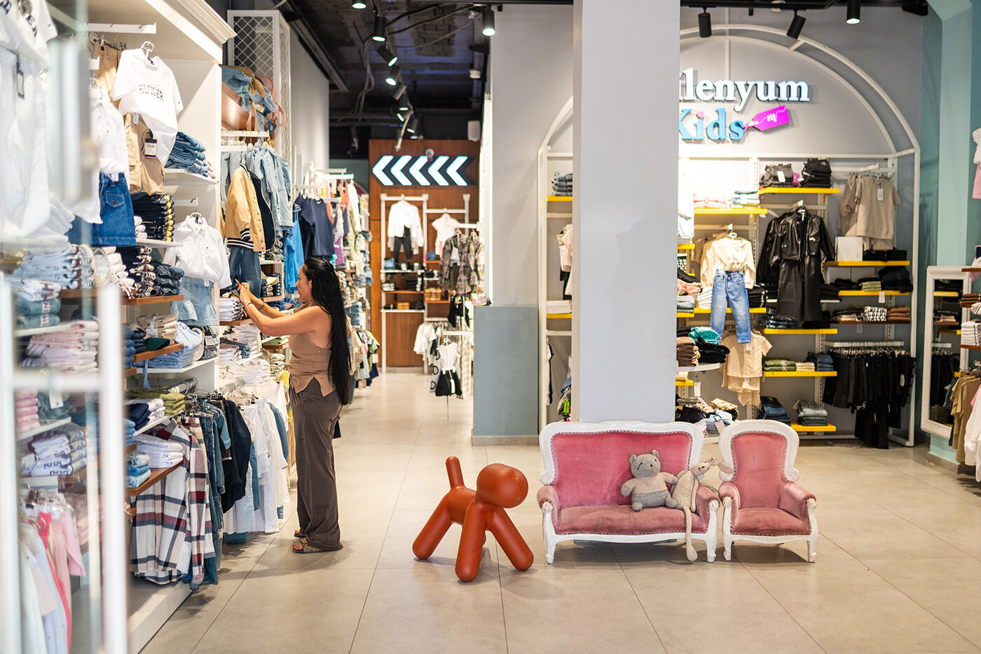 Customer browsing kidswear at Milenyum Kids